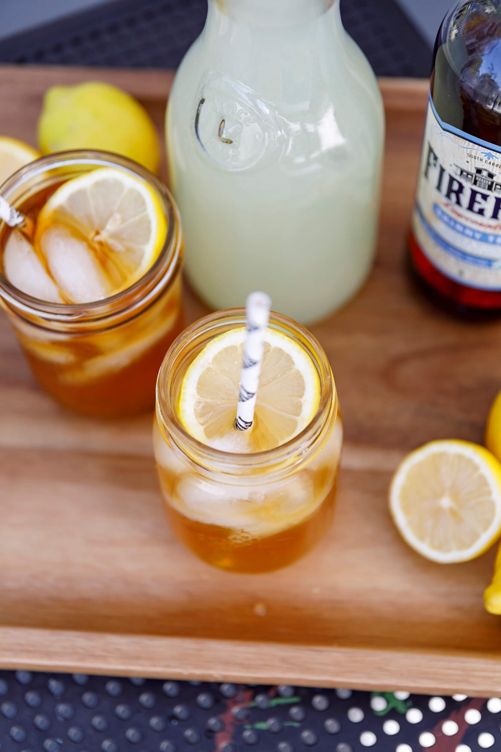 Cocktail glasses, lemonade pitcher, lemons
